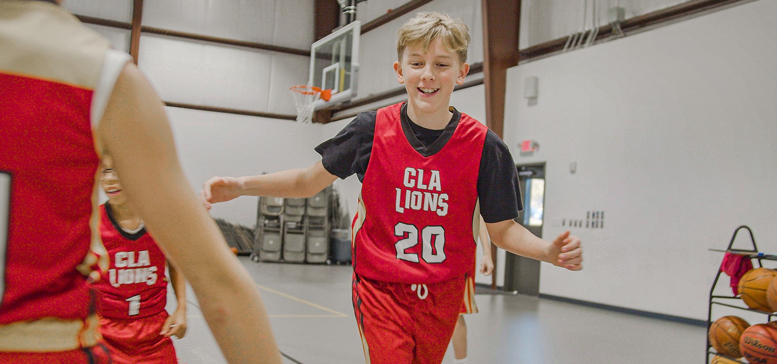 boys basketball player giving high-five